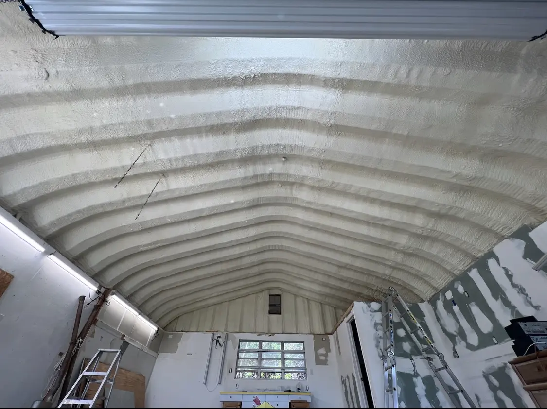 Spray polyurethane foam applied to the underside of a metal roof deck in Panama City Beach